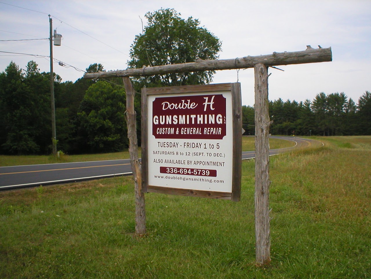 Double H Gunsmithing roadside sign